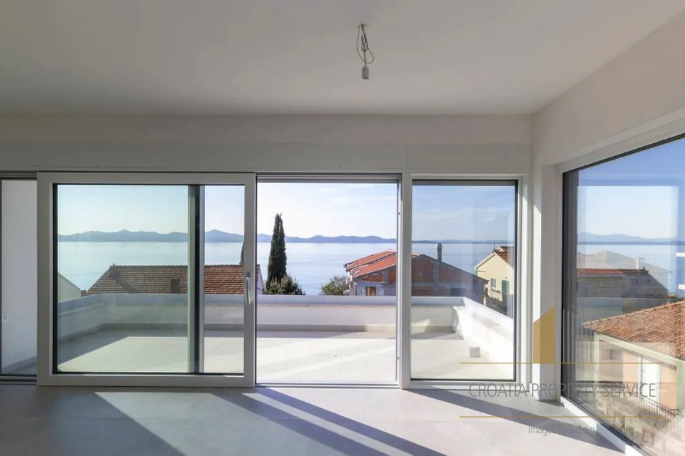 Modern twostory apartment with a roof terrace 45 m from the sea in the