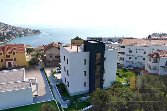 Apartment with a garden in a modern new building 200 m from the beach on the island of Čiovo!
