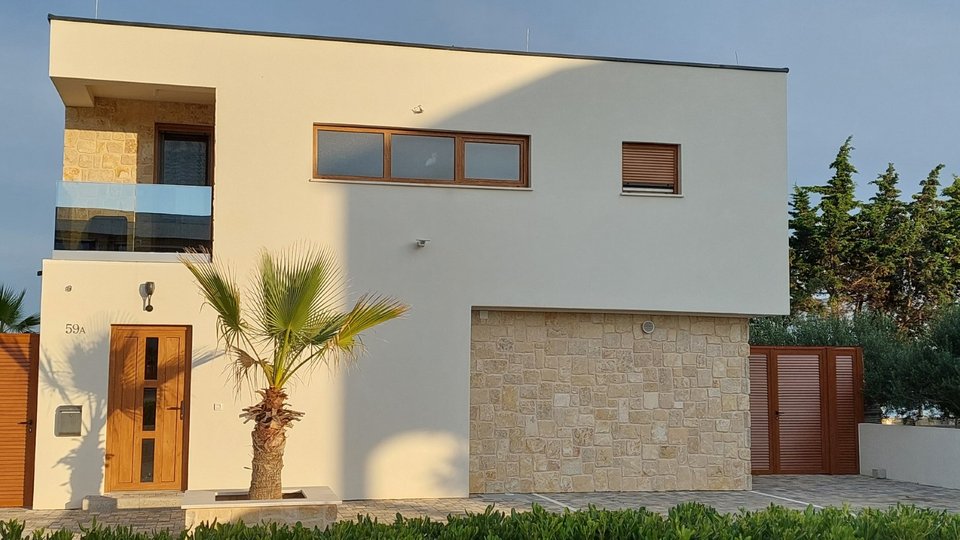 Modern luxury villa in an exceptional location, first row to the beach on the island of Vir!