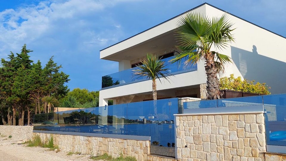Modern luxury villa in an exceptional location, first row to the beach on the island of Vir!